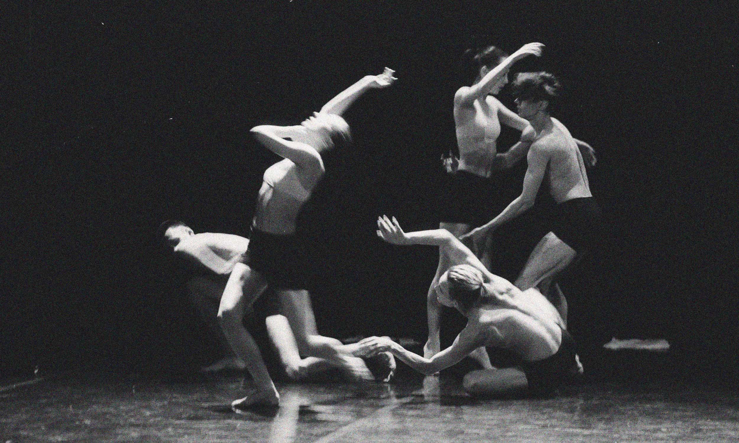 Black-and-white image of dancers in constant motion, symbolising the exhaustion of always performing.
